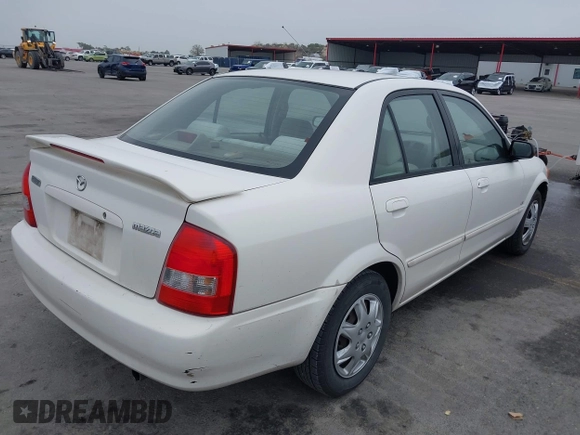 2000 Mazda Protege DX with VIN JM1BJ2220Y0273953, listed as a IAAI auction lot 41956058 with 158,837 mi miles and . Bid and sale history available at DreamBid. Image 4.