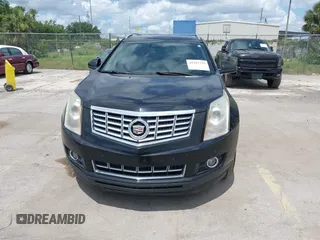 2015 Cadillac SRX Performance Collection z VIN 3GYFNCE31FS597798, wystawiony jako IAAI lot #42387793 z przebiegiem 159 986 mil mil oraz . Historia ofert i sprzedaży dostępna na DreamBid. Obrazek 6.