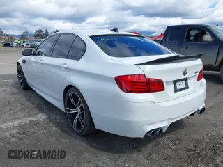 2013 BMW M5 with VIN WBSFV9C56DC772961, listed as a IAAI auction lot 41765457 with 104,568 mi miles. Bid and sale history available at carsss.com. Image 3.