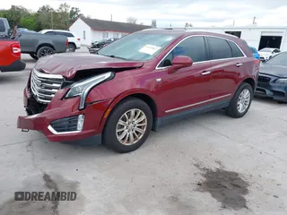 2017 Cadillac XT5 FWD with VIN 1GYKNARS2HZ107587, listed as a IAAI auction lot 41614842 with 124,611 mi miles and . Bid and sale history available at carsss.com. Image 17.