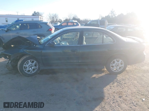 2001 Oldsmobile Intrigue GX z VIN 1G3WH52H11F127437, wystawiony jako IAAI lot #41446574 z przebiegiem Nie podano mil oraz . Historia ofert i sprzedaży dostępna na DreamBid. Obrazek 13.