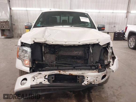 2012 Ford F-150 XL z VIN 1FTFW1CT7CFA05296, wystawiony jako IAAI lot #41976855 z przebiegiem 220 071 mil mil oraz . Historia ofert i sprzedaży dostępna na DreamBid. Obrazek 13.