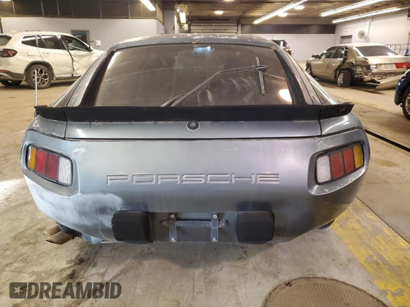 1984 Porsche 928 z VIN WP0JB0925ES861303, wystawiony jako Copart lot #41979575 z przebiegiem 114 593 mil mil oraz Nie do naprawy • Non repairable. Historia ofert i sprzedaży dostępna na DreamBid. Obrazek 6.