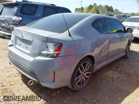2014 Scion tC with VIN JTKJF5C78E3075164, listed as a IAAI auction lot 41922609 with 142,064 mi miles. Bid and sale history available at carsss.com. Image 4.
