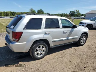 2009 Jeep Grand Cherokee Laredo with VIN 1J8HR48P29C537653, listed as a Copart auction lot 70190404 with 192,796 mi miles and Salvage Title. Bid and sale history available at carsss.com. Image 3.