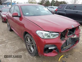 2021 BMW X4 xDrive30i z VIN 5UX2V1C02M9E92416, wystawiony jako IAAI lot #41960957 z przebiegiem 51 247 mil mil oraz . Historia ofert i sprzedaży dostępna na DreamBid. Obrazek 1.