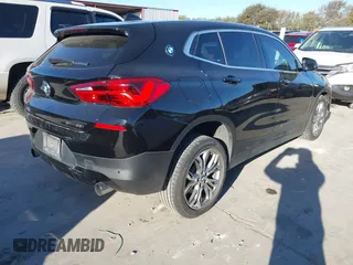 2019 BMW X2 sDrive28i with VIN WBXYJ3C50KEP77327, listed as a IAAI auction lot 40922194 with 94,672 mi miles. Bid and sale history available at carsss.com. Image 4.