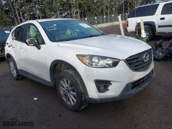 2016 Mazda CX-5 Touring with VIN JM3KE2CY1G0701106, listed as a IAAI auction lot 41514966 with NaN miles. Bid and sale history available at carsss.com. Image 1.