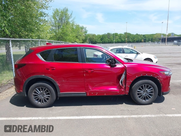 2020 Mazda CX-5 Touring z VIN JM3KFBCM4L0825150, wystawiony jako IAAI lot #42240406 z przebiegiem 21 864 mil mil oraz . Historia ofert i sprzedaży dostępna na DreamBid. Obrazek 13.
