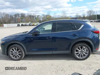 2019 Mazda CX-5 Grand Touring with VIN JM3KFBDM2K0603400, listed as a IAAI auction lot 42051135 with 59,448 mi miles and . Bid and sale history available at DreamBid. Image 14.