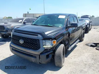 2019 Toyota Tundra SR with VIN 5TFUY5F13KX852912, listed as a IAAI auction lot 42327399 with 124,193 mi miles and . Bid and sale history available at DreamBid. Image 6.