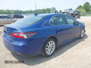 2023 Toyota Camry LE z VIN 4T1R11AK9PU180068, wystawiony jako IAAI lot #42483656 z przebiegiem 59 312 mil mil oraz . Historia ofert i sprzedaży dostępna na DreamBid. Obrazek 4.