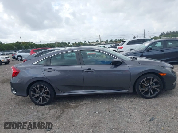 2019 Honda Civic Sport with VIN 2HGFC2F89KH563333, listed as a IAAI auction lot 41959217 with 66,068 mi miles and . Bid and sale history available at DreamBid. Image 13.