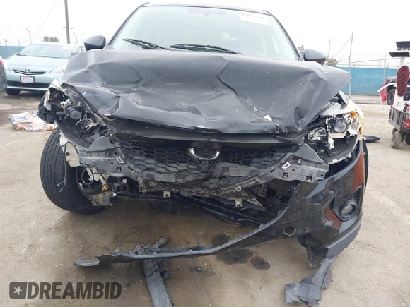 2014 Mazda CX-5 Touring z VIN JM3KE2CY3E0355332, wystawiony jako IAAI lot #42096306 z przebiegiem 108 198 mil mil oraz . Historia ofert i sprzedaży dostępna na DreamBid. Obrazek 6.