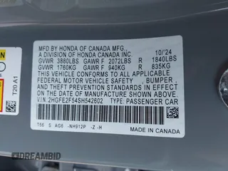 2025 Honda Civic Sport with VIN 2HGFE2F54SH542602, listed as a IAAI auction lot 42068927 with 7,110 mi miles and . Bid and sale history available at DreamBid. Image 9.