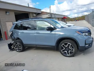 2023 Honda Passport Elite with VIN 5FNYF8H03PB000039, listed as a IAAI auction lot 40593339 with 33,697 mi miles and . Bid and sale history available at DreamBid. Image 13.