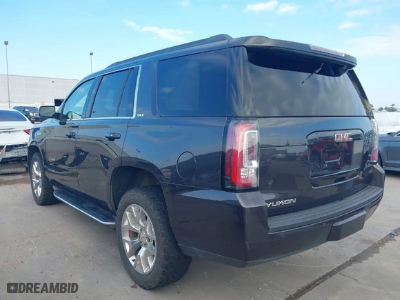 2016 GMC Yukon SLT with VIN 1GKS2BKC1GR406739, listed as a IAAI auction lot 41247286 with 106,023 mi miles. Bid and sale history available at carsss.com. Image 3.