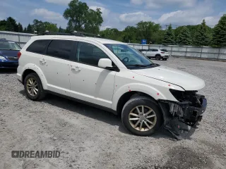 2017 Dodge Journey SXT with VIN 3C4PDDBG0HT542623, listed as a Copart auction lot 61628385 with 130,285 mi miles and Salvage title. Bid and sale history available at DreamBid. Image 4.
