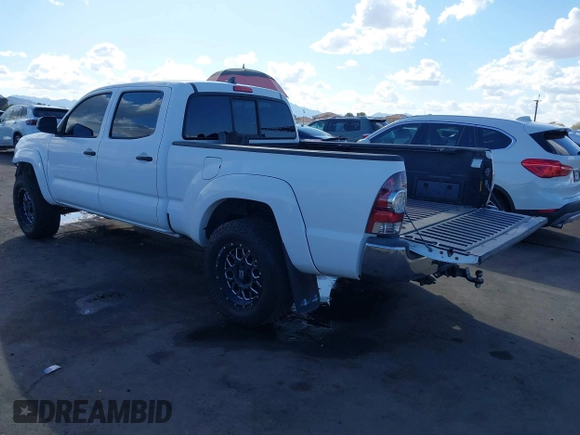 2014 Toyota Tacoma with VIN 3TMMU4FN9EM062808, listed as a IAAI auction lot 41450058 with 192,628 mi miles and . Bid and sale history available at DreamBid. Image 3.