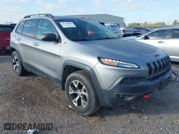 2015 Jeep Cherokee Trailhawk with VIN 1C4PJMBS3FW662307, listed as a IAAI auction lot 41778932 with 64,569 mi miles. Bid and sale history available at carsss.com. Image 1.