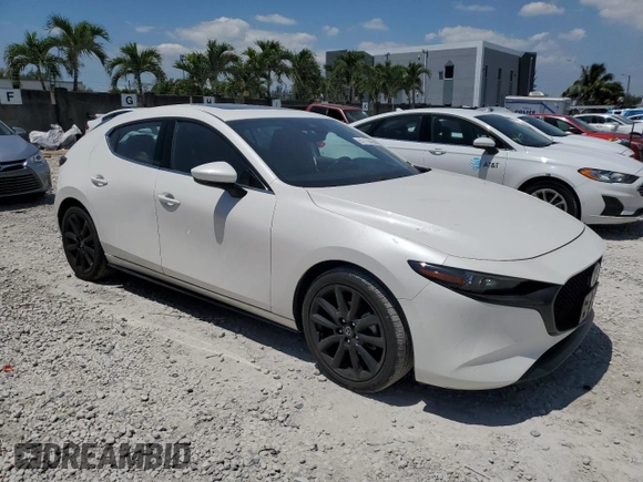 2021 Mazda 3 Premium with VIN JM1BPAML7M1313030, listed as a Copart auction lot 57112895 with 38,251 mi miles and Salvage Title. Bid and sale history available at DreamBid. Image 4.
