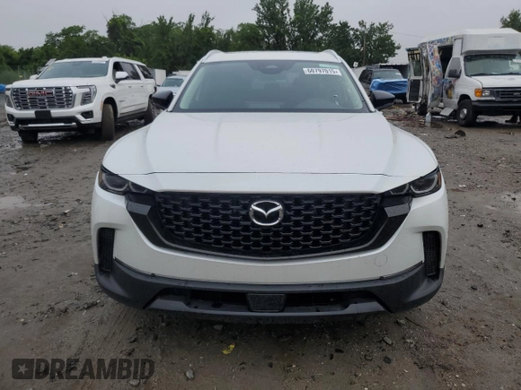 2025 Mazda CX-50 S Premium z VIN 7MMVABDM9SN331032, wystawiony jako Copart lot #60797015 z przebiegiem 9 572 mil mil oraz Nie do naprawy • Non repairable. Historia ofert i sprzedaży dostępna na DreamBid. Obrazek 5.