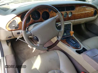 1999 Jaguar XK with VIN SAJGX2043XC040866, listed as a Copart auction lot 53712555 with 65,349 mi miles and Clean Title. Bid and sale history available at DreamBid. Image 8.
