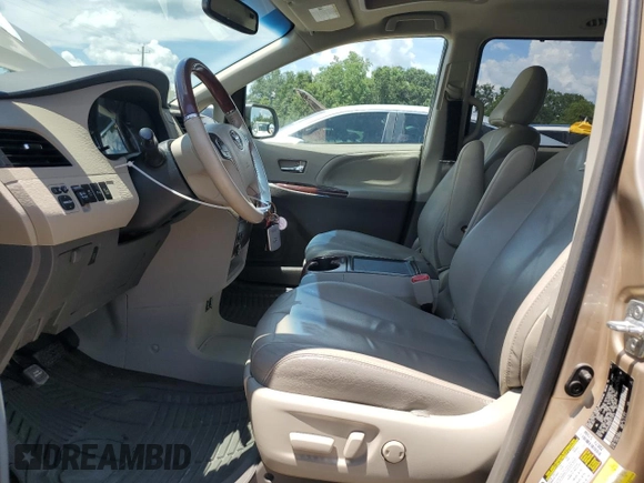 2014 Toyota Sienna XLE with VIN 5TDYK3DC8ES414814, listed as a Copart auction lot 64577875 with 111,675 mi miles and Salvage title. Bid and sale history available at DreamBid. Image 7.