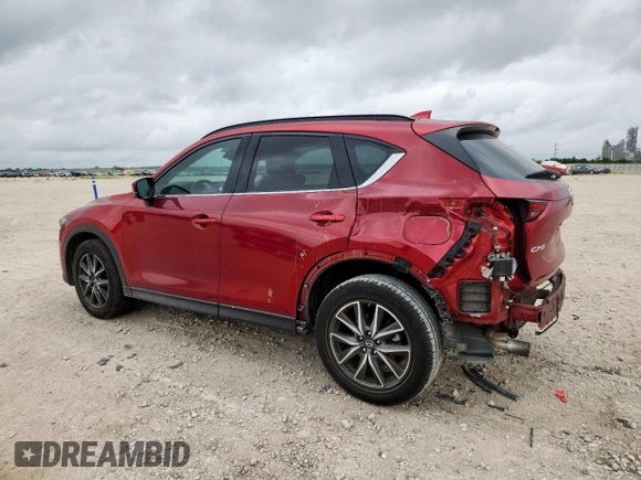 2018 Mazda CX-5 Grand Touring with VIN JM3KFADM8J0451535, listed as a Copart auction lot 59990435 with 77,163 mi miles and Salvage title. Bid and sale history available at DreamBid. Image 2.