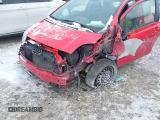 2011 Toyota Yaris with VIN JTDJT4K34B5329980, listed as a IAAI auction lot 41393540 with 84,987 mi miles. Bid and sale history available at carsss.com. Image 6.