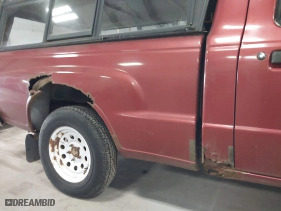 1999 Mazda B-Series 2WD Truck SX with VIN 4F4YR12C8XTM08476, listed as a IAAI auction lot 41864144 with NaN miles. Bid and sale history available at carsss.com. Image 14.