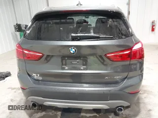 2018 BMW X1 xDrive28i with VIN WBXHT3C38J5L34625, listed as a IAAI auction lot 41133876 with 60,986 mi miles and . Bid and sale history available at DreamBid. Image 16.