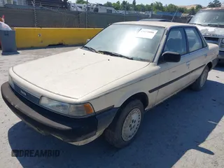 1987 Toyota Camry z VIN JT2SV21EXH3130273, wystawiony jako IAAI lot #42472806 z przebiegiem 124 958 mil mil oraz . Historia ofert i sprzedaży dostępna na DreamBid. Obrazek 2.