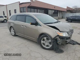2012 Honda Odyssey Touring with VIN 5FNRL5H9XCB078399, listed as a Copart auction lot 52360165 with 174,819 mi miles and Salvage Title. Bid and sale history available at DreamBid. Image 4.