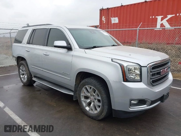 2015 GMC Yukon SLT with VIN 1GKS2BKCXFR131919, listed as a IAAI auction lot 41664827 with 149,398 mi miles. Bid and sale history available at carsss.com. Image 1.