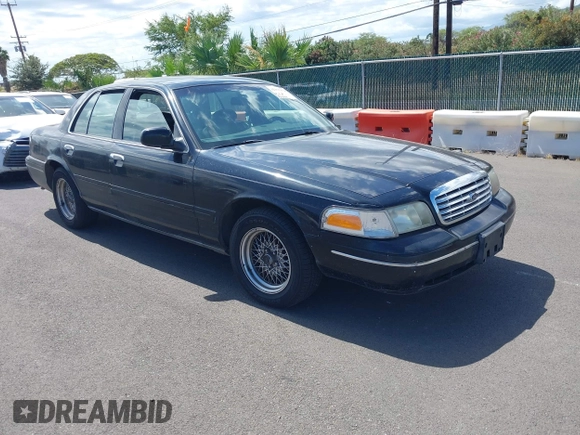 2000 Ford Crown Victoria LX z VIN 2FAFP74W1YX177737, wystawiony jako IAAI lot #42375378 z przebiegiem 90 359 mil mil oraz . Historia ofert i sprzedaży dostępna na DreamBid. Obrazek 1.
