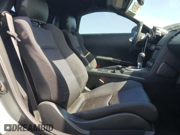 2004 Nissan 350Z Enthusiast z VIN JN1AZ36D34T110490, wystawiony jako Copart lot #57863915 z przebiegiem 139 757 mil mil oraz Szkody całkowita. Historia ofert i sprzedaży dostępna na DreamBid. Obrazek 10.