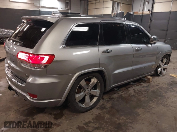 2015 Jeep Grand Cherokee Overland with VIN 1C4RJFCG1FC215426, listed as a IAAI auction lot 41689821 with 128,563 mi miles. Bid and sale history available at carsss.com. Image 4.