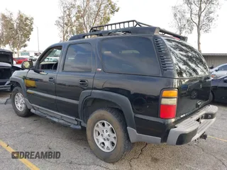 2004 Chevrolet Tahoe LS with VIN 1GNEK13T64R265302, listed as a IAAI auction lot 41445237 with 242,840 mi miles. Bid and sale history available at carsss.com. Image 3.