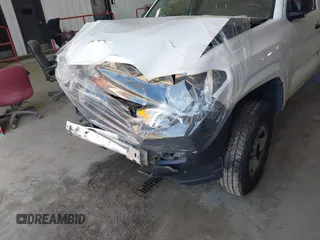 2020 Toyota Tacoma SR with VIN 5TFRX5GN1LX177797, listed as a IAAI auction lot 41882427 with 107,787 mi miles and . Bid and sale history available at DreamBid. Image 6.