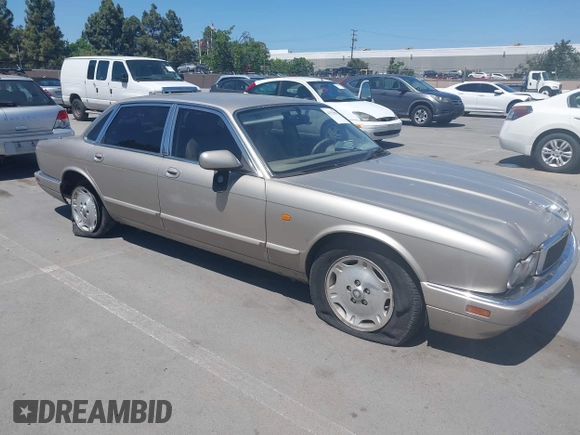 1997 Jaguar XJ with VIN SAJHX1243VC811674, listed as a IAAI auction lot 42333801 with 213,248 mi miles and . Bid and sale history available at DreamBid. Image 1.