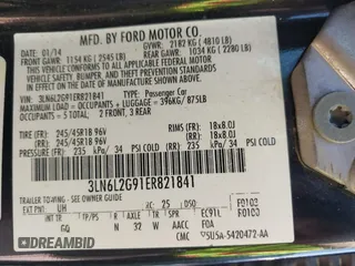 2014 Lincoln MKZ z VIN 3LN6L2G91ER821841, wystawiony jako IAAI lot #42655383 z przebiegiem Nie podano mil oraz . Historia ofert i sprzedaży dostępna na DreamBid. Obrazek 9.