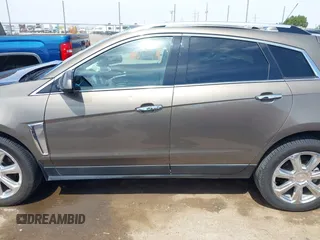 2016 Cadillac SRX Performance Collection z VIN 3GYFNCE39GS512286, wystawiony jako IAAI lot #42392467 z przebiegiem 95 708 mil mil oraz . Historia ofert i sprzedaży dostępna na DreamBid. Obrazek 14.