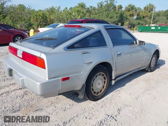 1987 Nissan 300ZX z VIN JN1HZ14S6HX214121, wystawiony jako IAAI lot #42204712 z przebiegiem 218 637 mil mil oraz . Historia ofert i sprzedaży dostępna na DreamBid. Obrazek 4.