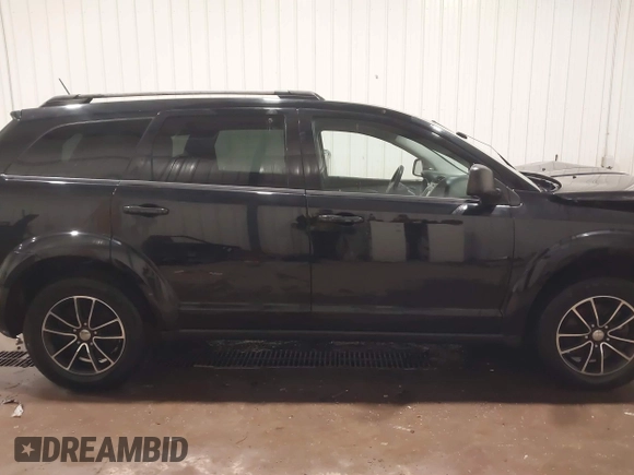 2017 Dodge Journey SE z VIN 3C4PDCAB4HT695490, wystawiony jako IAAI lot #41301719 z przebiegiem 103 642 mil mil oraz . Historia ofert i sprzedaży dostępna na DreamBid. Obrazek 14.