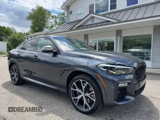 2021 BMW X6 M50i z VIN 5UXCY8C03M9E38577, wystawiony jako Copart lot #61396455 z przebiegiem 69 830 mil mil oraz Czysty tytuł • Clean title. Historia ofert i sprzedaży dostępna na DreamBid. Obrazek 1.