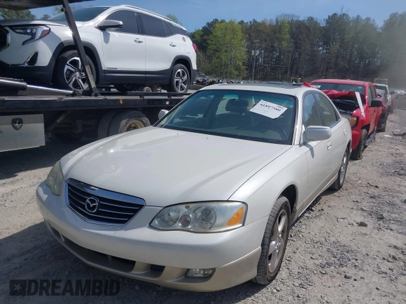 2001 Mazda Millenia with VIN JM1TA221011711379, listed as a IAAI auction lot 41897580 with 151,307 mi miles and . Bid and sale history available at DreamBid. Image 2.
