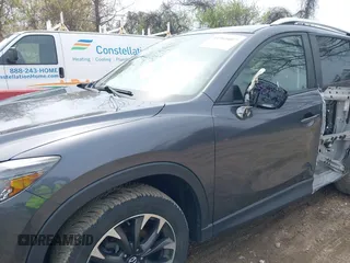 2016 Mazda CX-5 Grand Touring with VIN JM3KE4DYXG0830150, listed as a IAAI auction lot 41961007 with 142,570 mi miles and . Bid and sale history available at DreamBid. Image 18.
