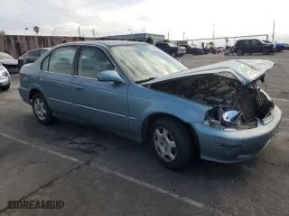 2000 Honda Civic EX with VIN 2HGEJ8643YH589565, listed as a Copart auction lot 53119425 with 134,068 mi miles and Salvage Title. Bid and sale history available at carsss.com. Image 4.