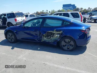 2023 Tesla Model 3 with VIN 5YJ3E1EA1PF431190, listed as a IAAI auction lot 41980007 with 26,164 mi miles and . Bid and sale history available at DreamBid. Image 14.
